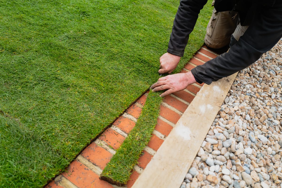 Laying artificial turf